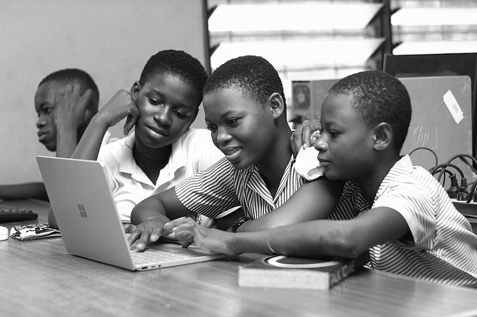 Students working together on a laptop computer