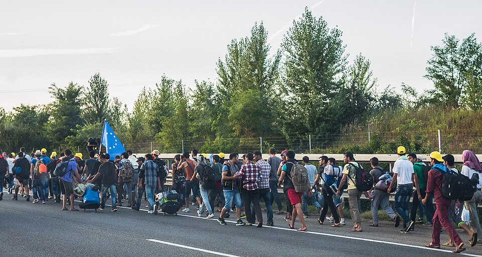 Refugees walking along a road toward Austria and Germany, September 2015