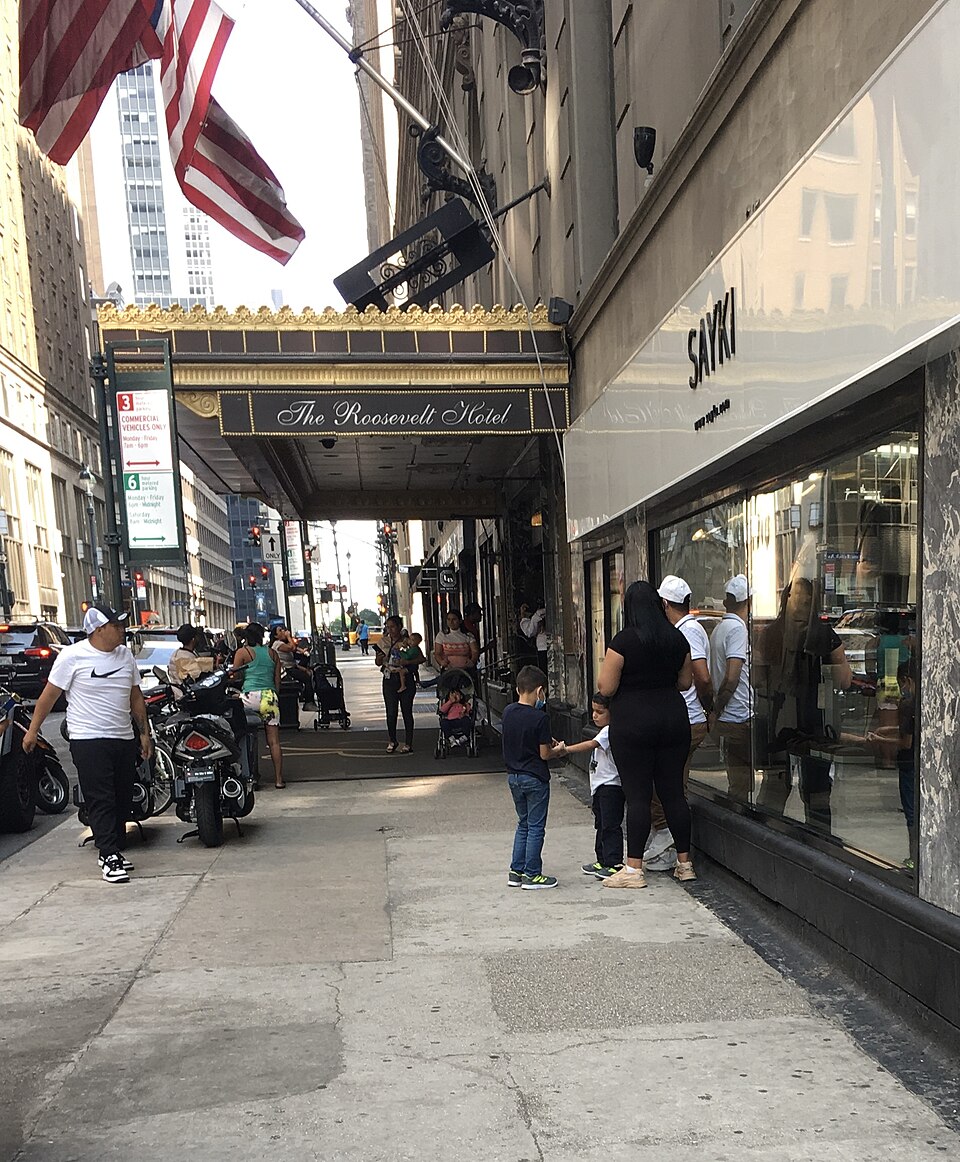 Asylum seekers waiting outside the Roosevelt Hotel in New York City
