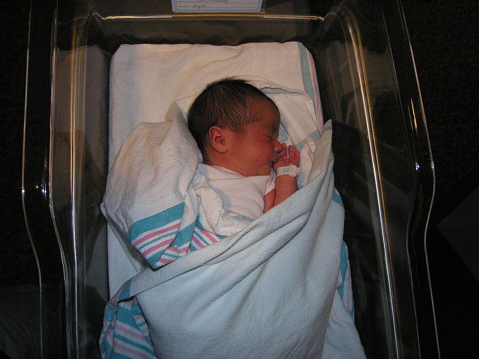 A newborn baby in a hospital